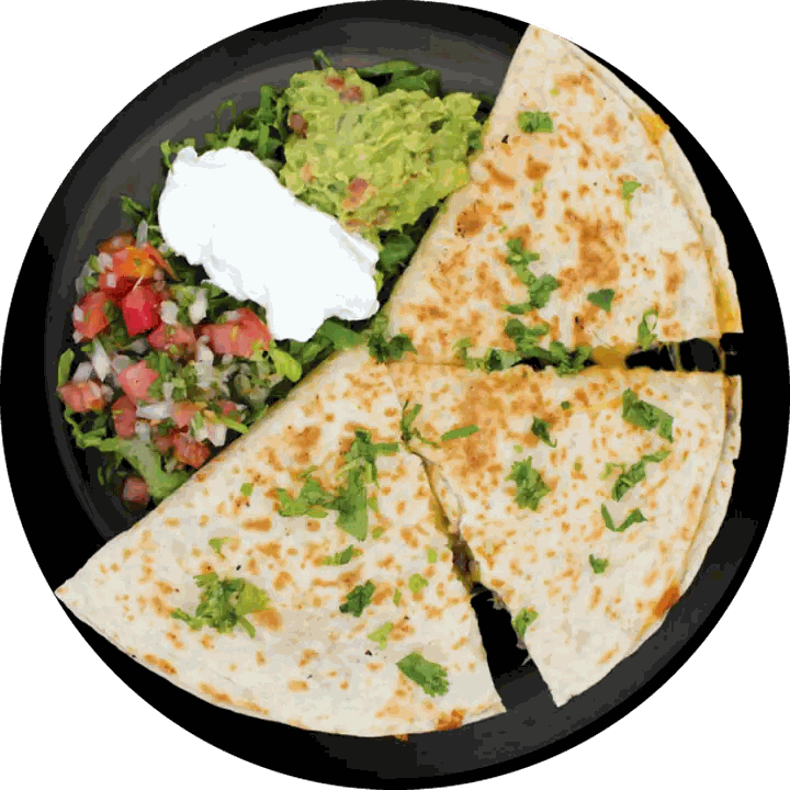 Quesadilla cut in four with guacamole, sour cream and pico de gallo