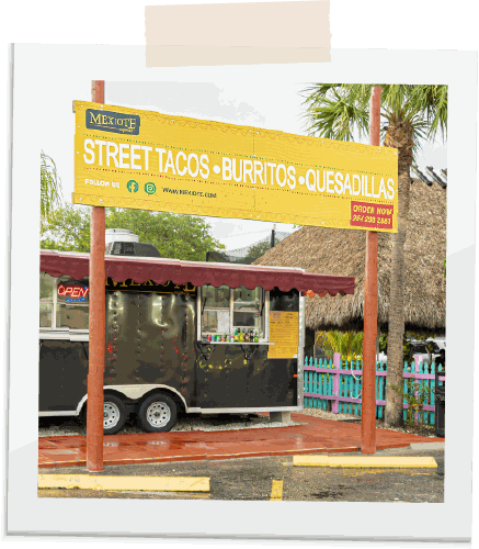 Polaroid of the Mexiote stand with its yellow street tacos sign